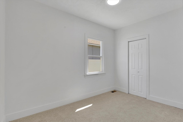 3903 E Hartson Ave, Spokane, WA 99202 - unfurnished room featuring light carpet and baseboards