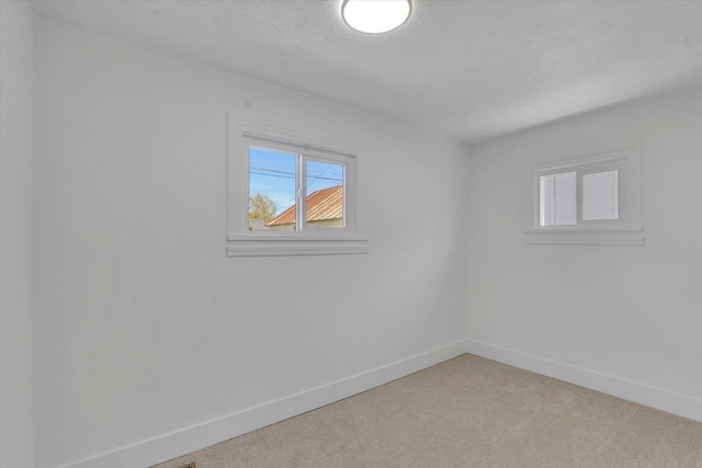 3903 E Hartson Ave, Spokane, WA 99202 - empty room with baseboards and light carpet