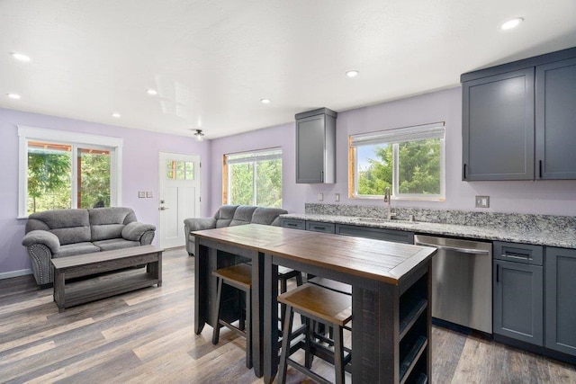 362 Panorama Dr, Newport, WA 99156 - kitchen with stainless steel dishwasher, wood finished floors, open floor plan, recessed lighting, and a sink