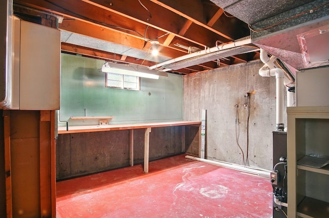 basement with a workshop area