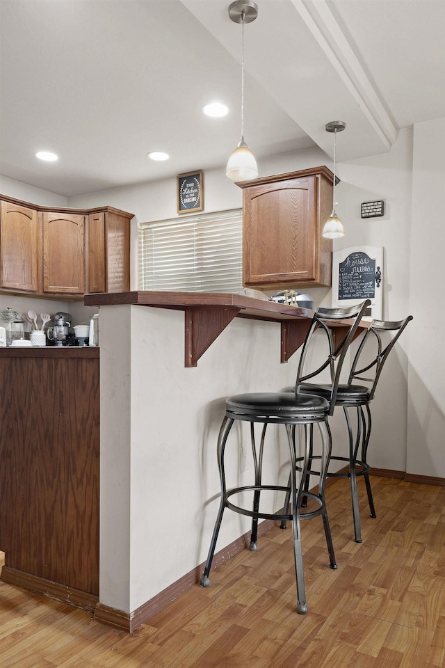 3713 S Harrison St, Spokane, WA 99224 - kitchen with pendant lighting, baseboards, light wood finished floors, a breakfast bar, and recessed lighting