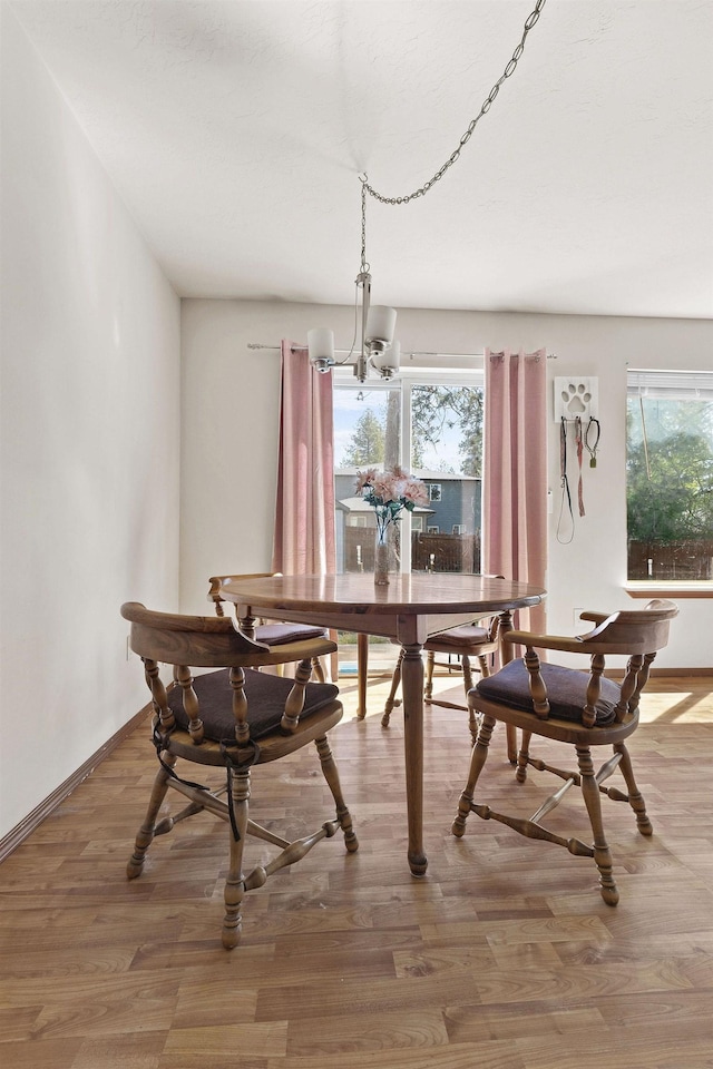 3713 S Harrison St, Spokane, WA 99224 - dining room featuring an inviting chandelier, baseboards, and wood finished floors