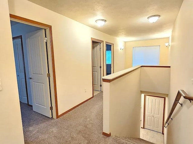 3713 S Harrison St, Spokane, WA 99224 - hall with baseboards, an upstairs landing, and carpet