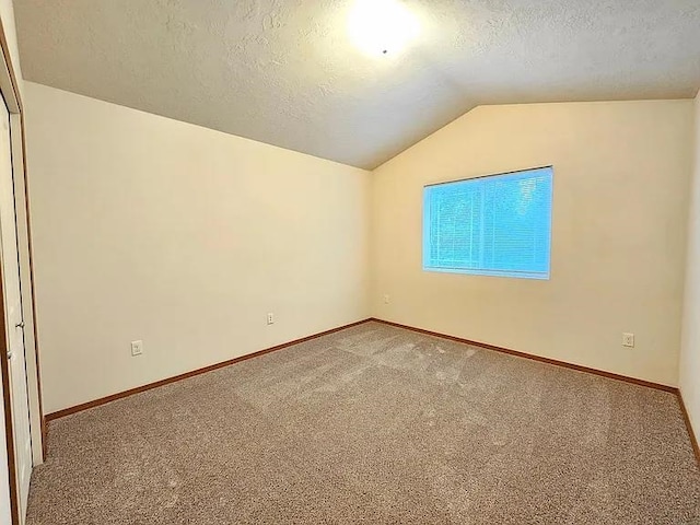 3713 S Harrison St, Spokane, WA 99224 - interior space featuring baseboards, carpet, a textured ceiling, and vaulted ceiling