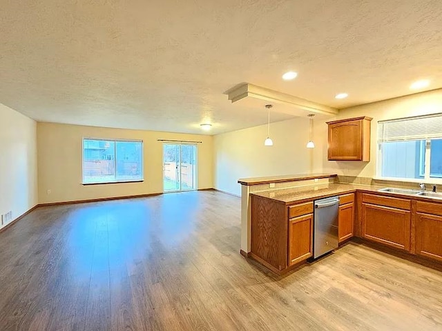 3713 S Harrison St, Spokane, WA 99224 - kitchen featuring brown cabinetry, open floor plan, and a peninsula