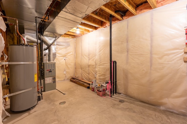 unfinished basement featuring water heater