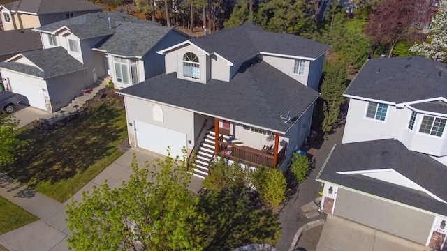 birds eye view of property with a residential view