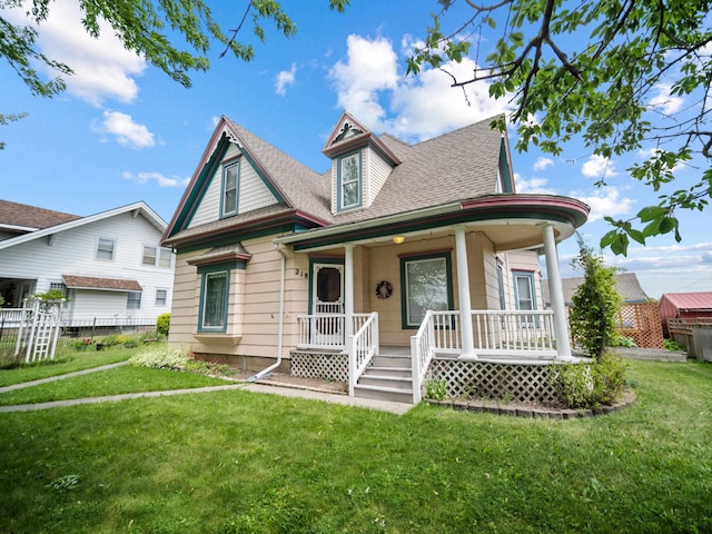 218 S Broadway St, Tekoa, WA 99033 - victorian house featuring a porch and a shingled roof