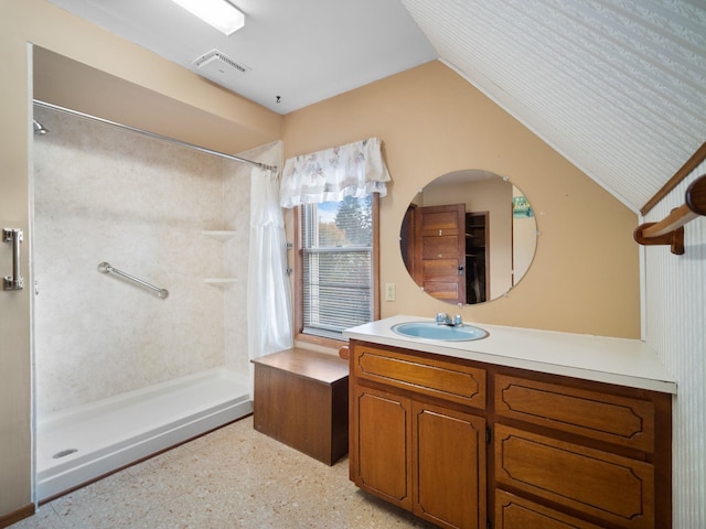 218 S Broadway St, Tekoa, WA 99033 - bathroom featuring a shower with curtain, vanity, and vaulted ceiling