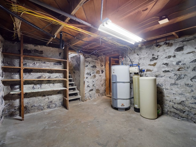 218 S Broadway St, Tekoa, WA 99033 - unfinished basement featuring a water softener and stairway