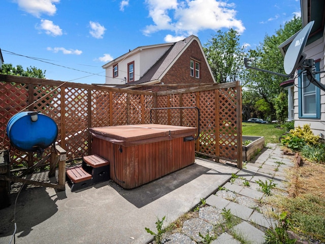 218 S Broadway St, Tekoa, WA 99033 - view of patio / terrace featuring a hot tub