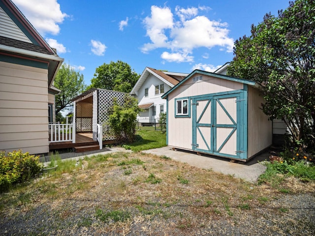 218 S Broadway St, Tekoa, WA 99033 - view of yard with a storage shed and a wooden deck