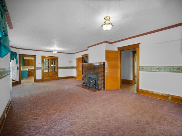 218 S Broadway St, Tekoa, WA 99033 - unfurnished living room with carpet, crown molding, and a textured ceiling