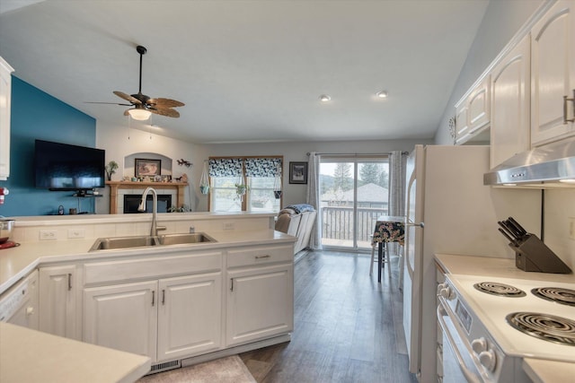 6805 Royal Ln, Spokane, WA 99208 - kitchen with white electric stove, exhaust hood, a ceiling fan, vaulted ceiling, and a sink