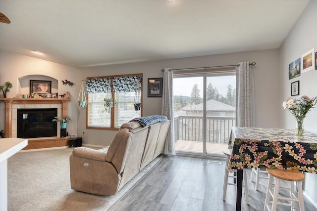 6805 Royal Ln, Spokane, WA 99208 - living room with a glass covered fireplace, wood finished floors, and baseboards