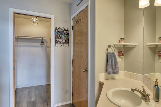 6805 Royal Ln, Spokane, WA 99208 - bathroom with a sink and wood finished floors