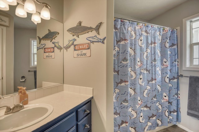 6805 Royal Ln, Spokane, WA 99208 - bathroom featuring vanity and a shower with shower curtain