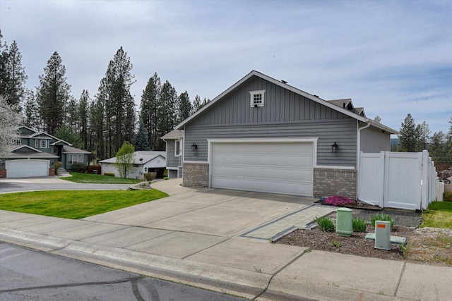 6805 Royal Ln, Spokane, WA 99208 - view of front of property with brick siding, driveway, and a garage