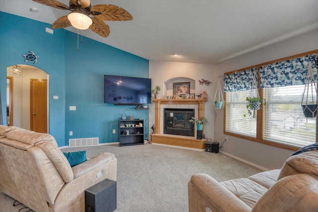 6805 Royal Ln, Spokane, WA 99208 - living area with carpet floors, ceiling fan, lofted ceiling, baseboards, and a tile fireplace