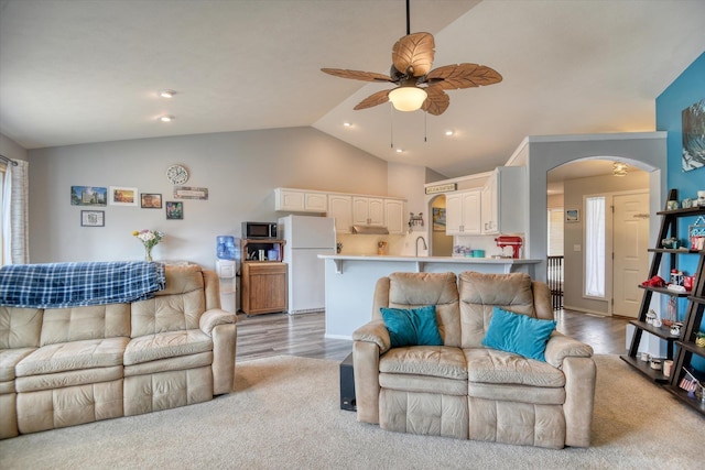 6805 Royal Ln, Spokane, WA 99208 - living room featuring ceiling fan, arched walkways, light wood finished floors, high vaulted ceiling, and recessed lighting