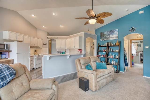 6805 Royal Ln, Spokane, WA 99208 - living area featuring arched walkways, high vaulted ceiling, ceiling fan, recessed lighting, and baseboards