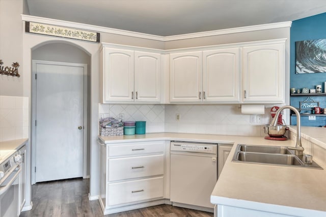 6805 Royal Ln, Spokane, WA 99208 - kitchen with dishwasher, a sink, dark wood-style floors, white cabinetry, and crown molding