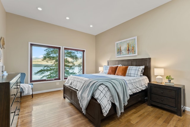 bedroom featuring recessed lighting, baseboards, and light wood finished floors