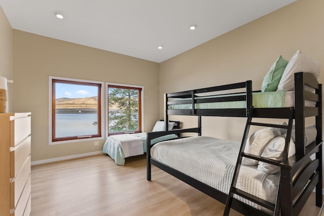 bedroom with recessed lighting, baseboards, and light wood-style floors
