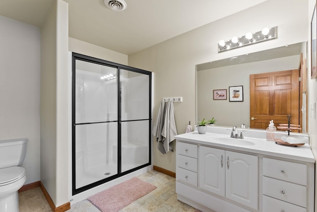 bathroom with visible vents, a stall shower, vanity, baseboards, and toilet