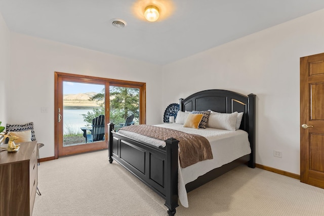 bedroom with baseboards, visible vents, access to exterior, and light colored carpet
