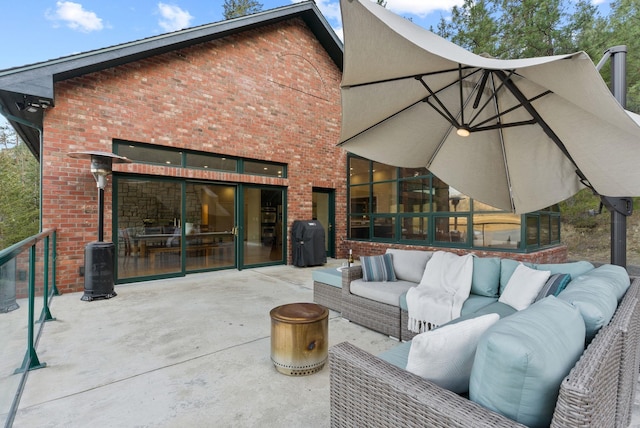 view of patio with outdoor lounge area and grilling area