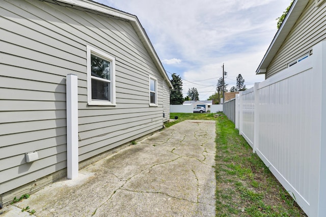 view of property exterior featuring fence