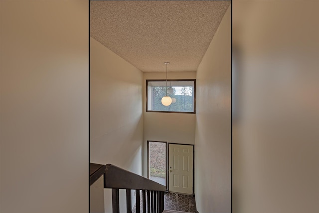 2514 E Casper Dr, Spokane, WA 99223 - stairs featuring a textured ceiling
