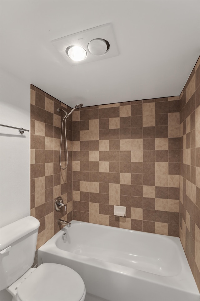 bathroom with bathing tub / shower combination and toilet