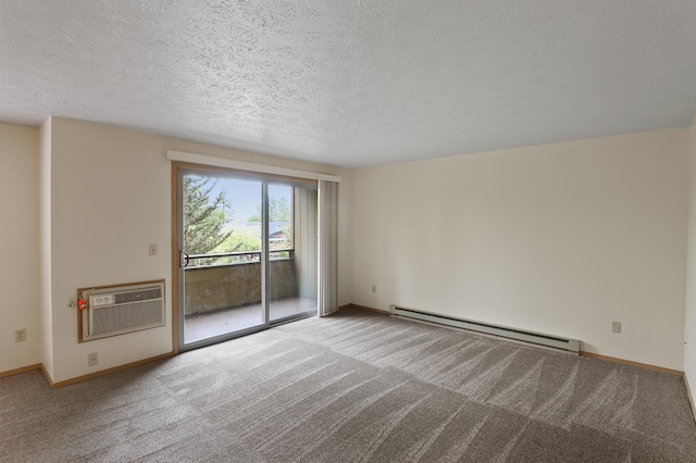 carpeted empty room featuring baseboards, baseboard heating, a textured ceiling, and a wall mounted air conditioner