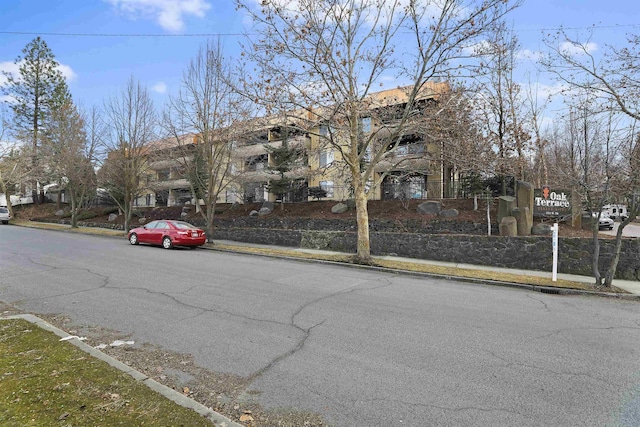 exterior space featuring curbs and sidewalks