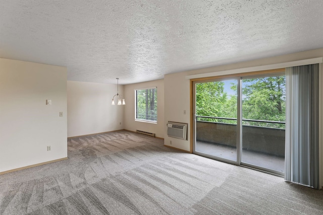 interior space with a notable chandelier, a wall mounted air conditioner, a textured ceiling, baseboards, and a baseboard heating unit