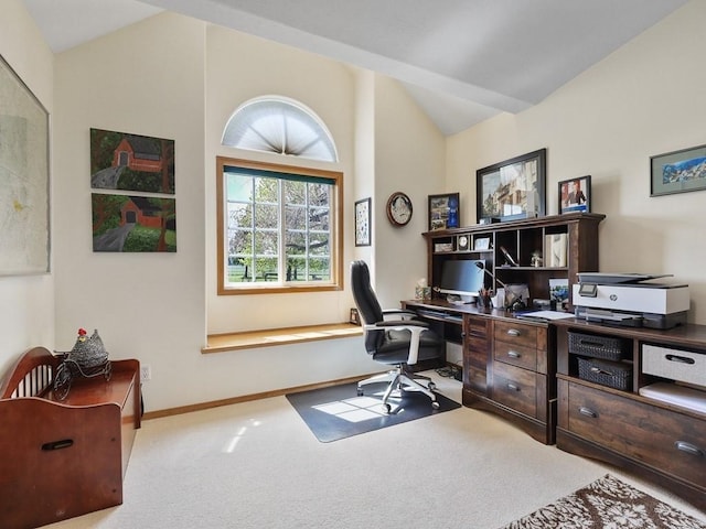 office area with baseboards, carpet flooring, and lofted ceiling