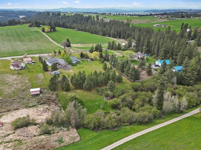 birds eye view of property featuring a rural view