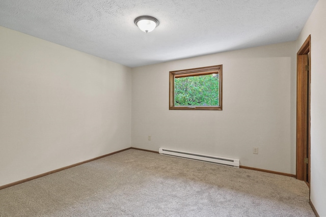 carpeted empty room featuring baseboards, a baseboard radiator, and a textured ceiling