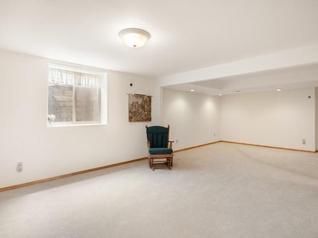 8409 N Pine Meadows Ln, Nine Mile Falls, WA 99026 - unfurnished room with baseboards and carpet