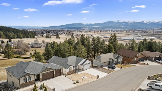 drone / aerial view with a mountain view and a residential view