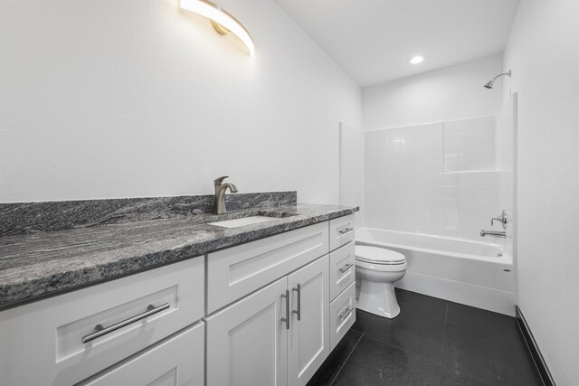 bathroom with toilet, shower / bathing tub combination, and vanity