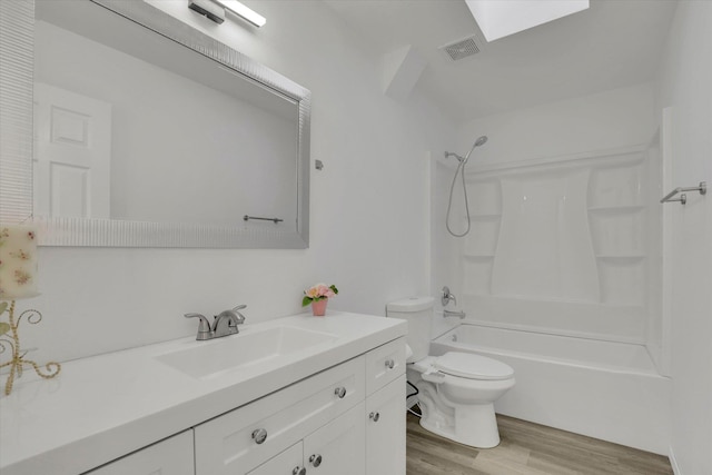 129 E Wynot Dr, Nine Mile Falls, WA 99026 - bathroom featuring visible vents, vanity, shower / bathtub combination, wood finished floors, and toilet
