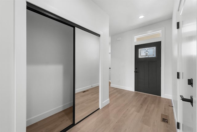 entrance foyer featuring recessed lighting, baseboards, visible vents, and light wood-type flooring