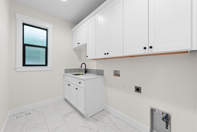 laundry area with baseboards, marble finish floor, cabinet space, and hookup for an electric dryer