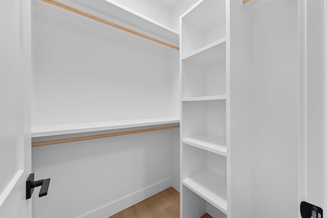 spacious closet featuring wood finished floors