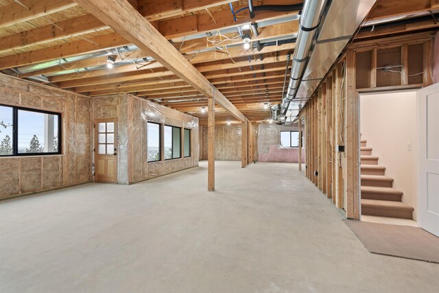 basement with stairway and plenty of natural light