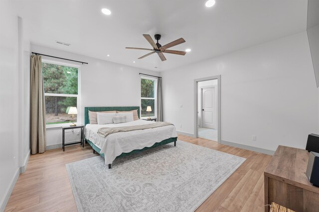 bedroom featuring recessed lighting, light wood-style flooring, and visible vents
