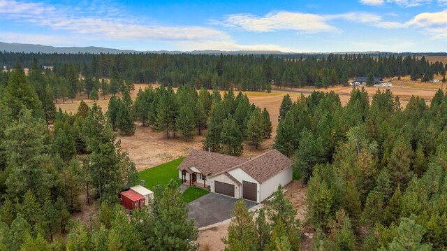 aerial view with a wooded view